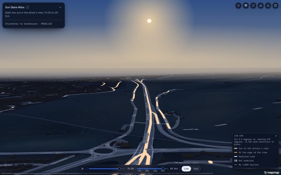 Sussex roads drawn gold where a low sun sits in the driver's view, with the time slider.