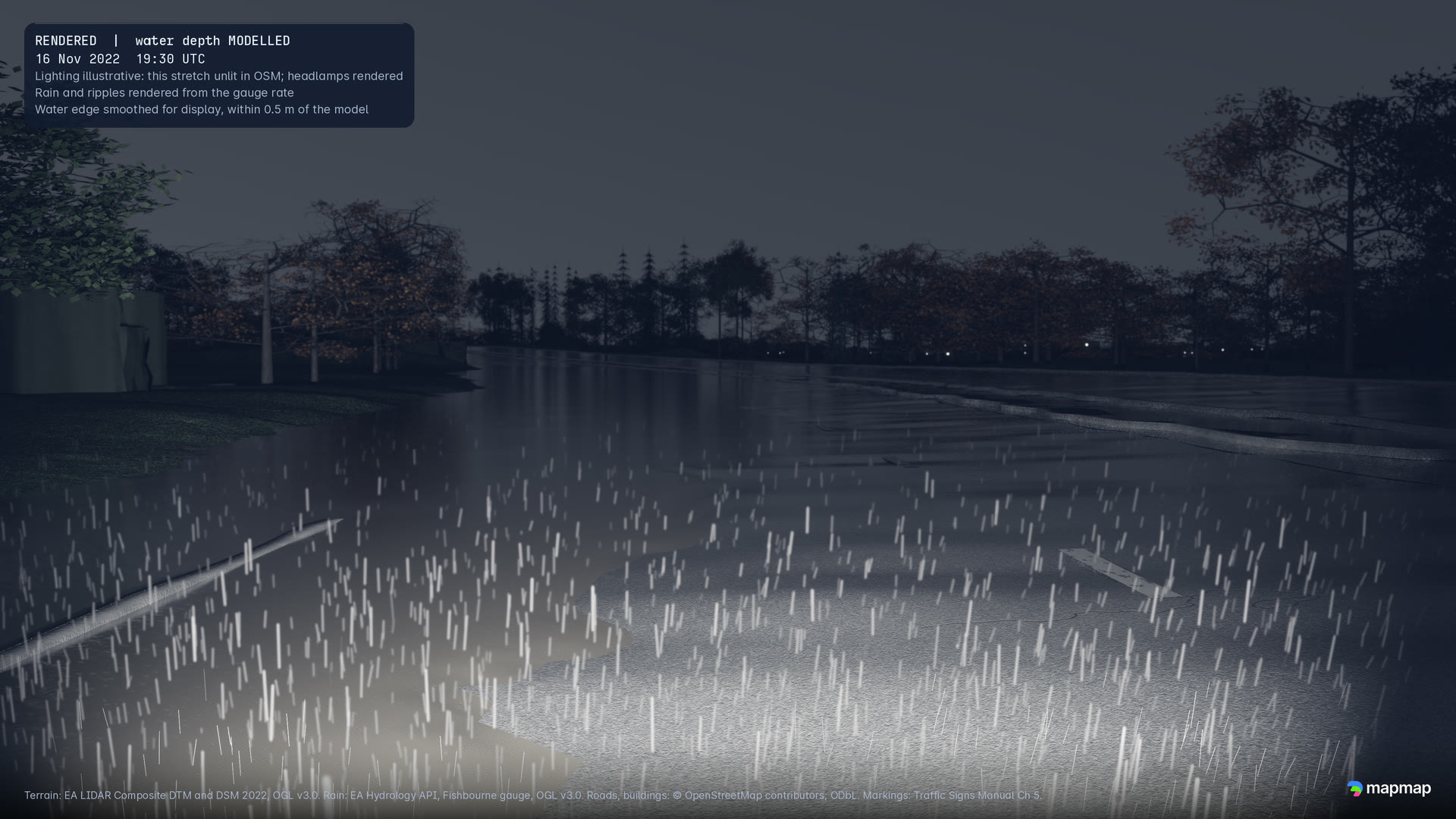 A driver's eye view at 19:30 UTC on an unlit stretch: rain lit by the headlamps over modelled water across the road, trees on the skyline.