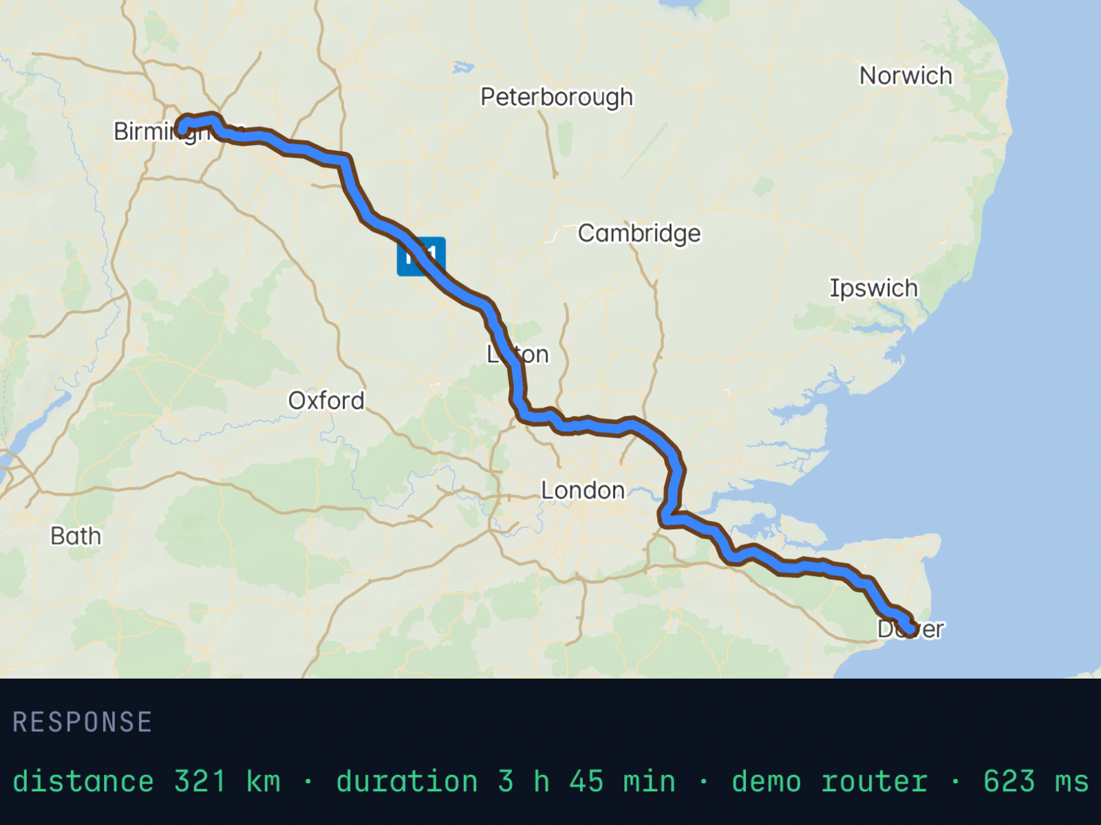 A MapMap map of southern England with a truck route drawn from Dover to Birmingham, and the API response below it: distance 321 km, duration 3 h 45 min