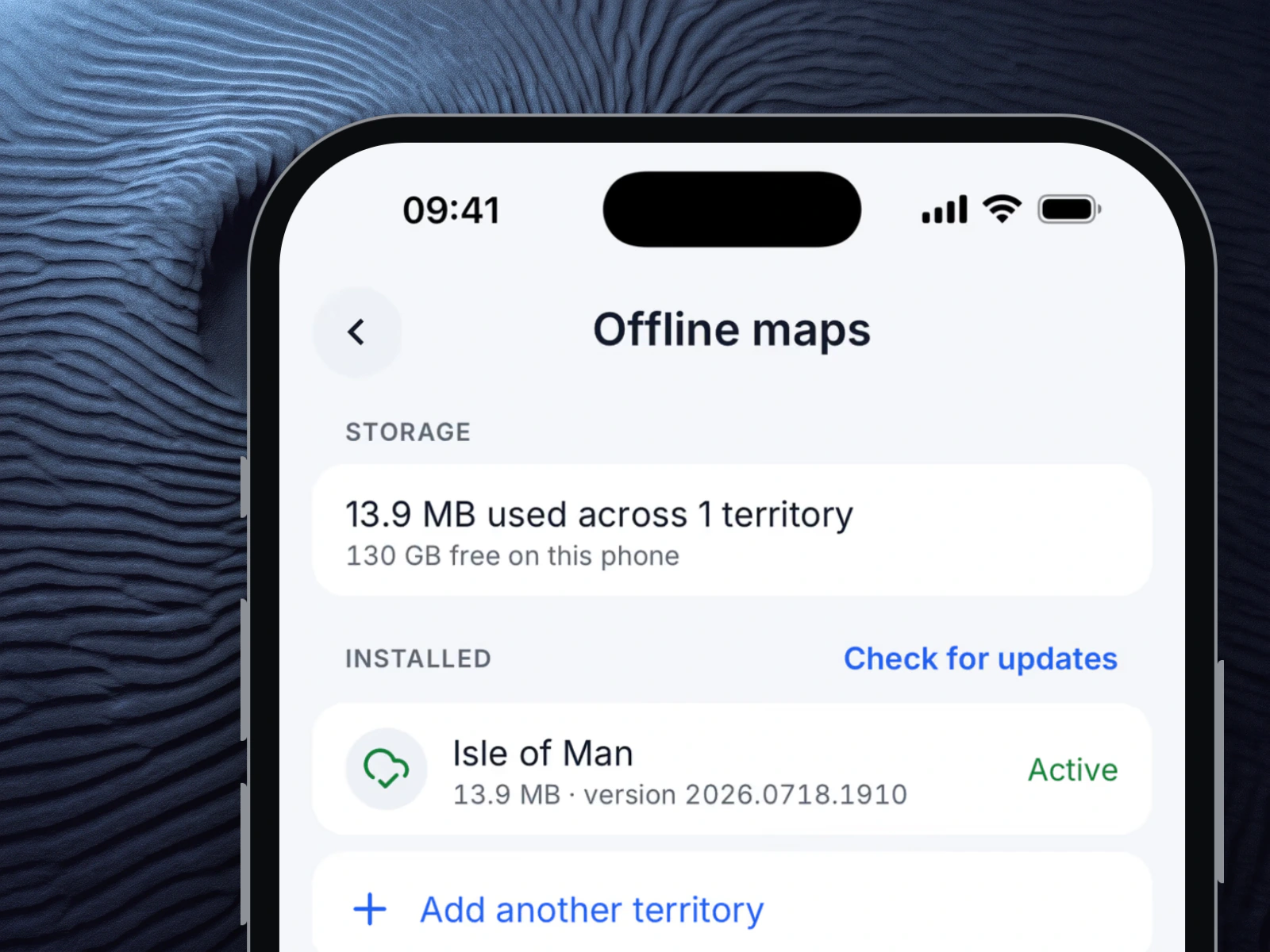 MapMap Nav on an iPhone on a dark relief backdrop, showing the Offline maps screen: 13.9 MB used across 1 territory, Isle of Man installed and active