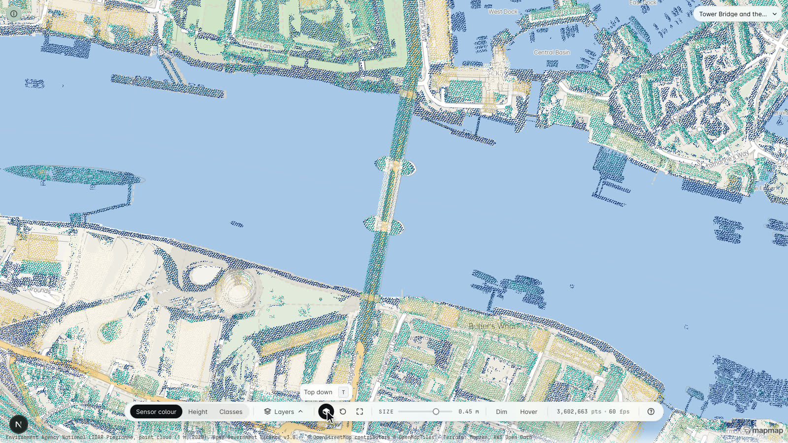 The MapMap lidar viewer looking straight down on Tower Bridge with the basemap undimmed: the bridge deck, its two towers and the quaysides either side drawn as lidar points that sit exactly on the streets and river edges the basemap draws underneath them
